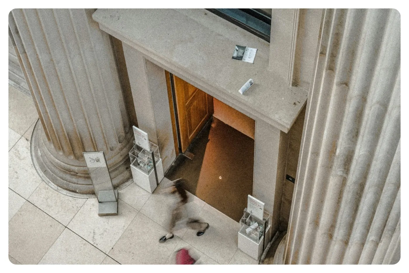 woman standing beside gray column at the Brisitsh Museum in London UK