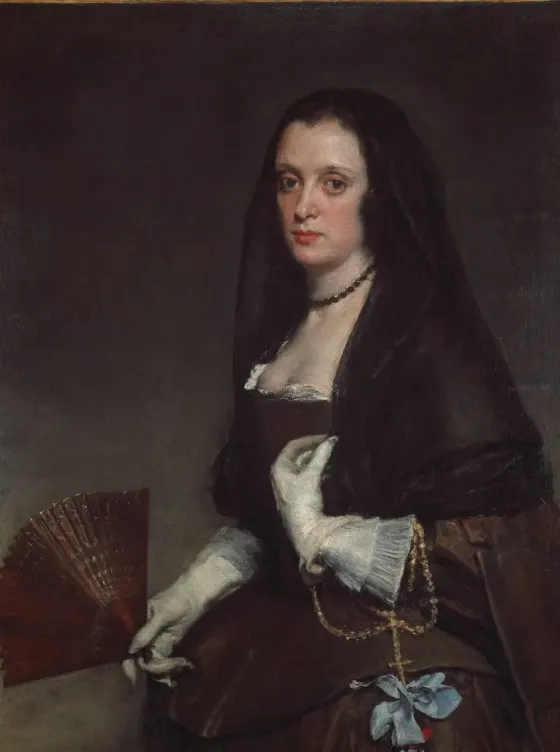 The Lady with a Fan by Diego Velazquez: a woman in black holding a red fan